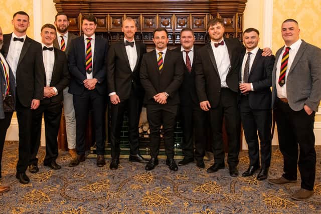 Wayne Barnes with members of Harrogate RUFC's senior men's teams.