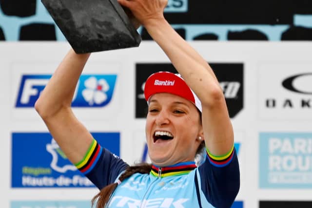 Lizzie Deignan holds her trophy aloft after she won the first edition of the women's elite race of the 'Paris-Roubaix' cycling event. Picture: Eric Lalmand/Getty Images