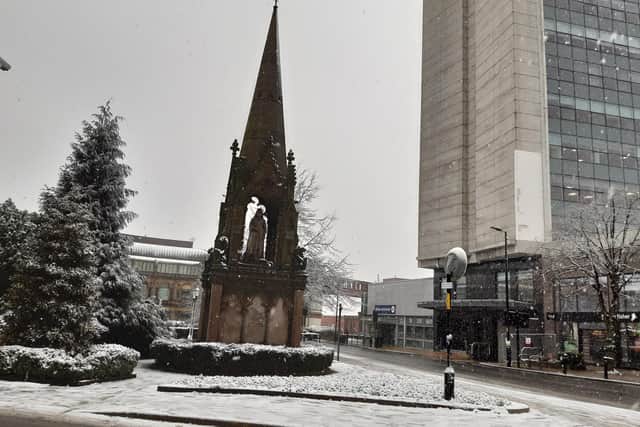 Winter snow falling near the Queen Victoria Jubilee Memorial on Station Parade in Harrogate earlier today, Thursday. (Picture Graham Chalmers)