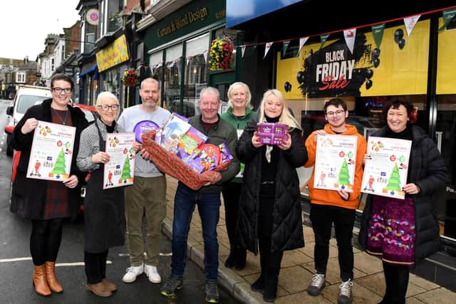 The return of Commercial Street's Harrogate Christmas Chocolate Collection - From left Hanne Jackson-Newboult of Disability Action Yorkshire, Gilly Mason from Cheese Board, Alex Tabor of Bluebeard Barber Shop, Tony Sponge of Curtain and Blind Design, Dawn Cussons of Harrogate District Food Bank, Sue Kramer of Crown Jewellers, Robyn Precious of Harrogate Hospital and Community Charity and Kate Rogata of Supporting Older People. (Picture Gerard Binks)