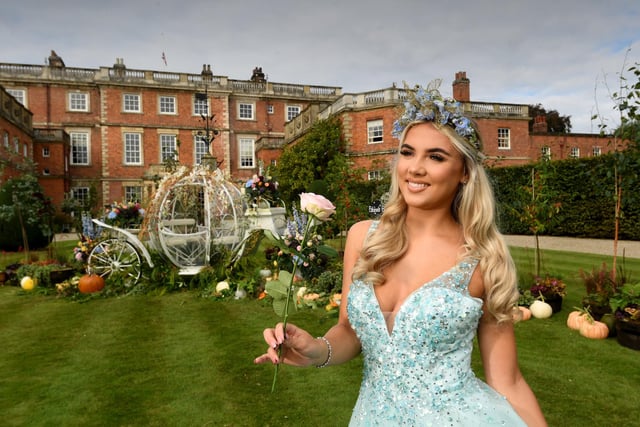Kathryn Moore dressed as Cinderella in front of the house at Newby Hall