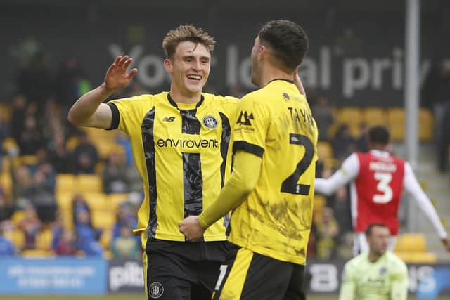 Tom Cursons, left, celebrates with Ellis Taylor after the latter set up the former to fire Harrogate Town into a 3-1 lead against Fleetwood at Wetherby Road.