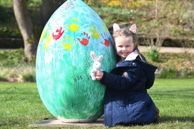Four-year-old Maddie Simpson with one of the giant eggs