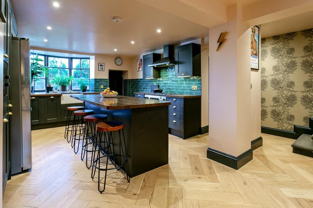 The stunning open plan kitchen with central island.