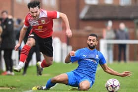 Knaresborough Town winger Theo Hudson hurdles a challenge during Saturday's goalless draw with Eccleshill United. Pictures: Gerard Binks