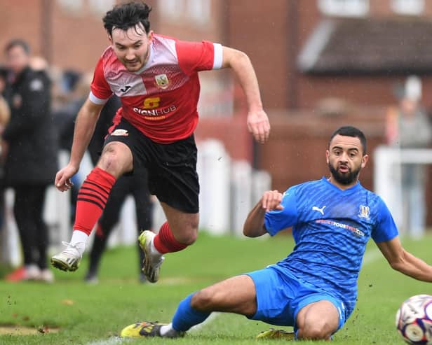 Knaresborough Town winger Theo Hudson hurdles a challenge during Saturday's goalless draw with Eccleshill United. Pictures: Gerard Binks