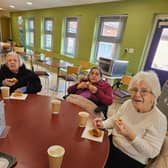 Residents Pat Dempsey, Lillian Smythe and Anna Mason from HC-One’s Redesdale Court Care Home enjoying a cup of tea and berry muffin in their local café