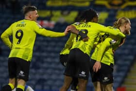 Luke Armstrong, right, is congratulated by his team-mates after firing Harrogate Town into a 2-1 lead against Rochdale. Pictures: Matt Kirkham