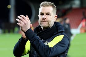 Harrogate Town manager Simon Weaver applauds the club's travelling fans following Tuesday's goalless draw at Wrexham. Picture: Matt Kirkham