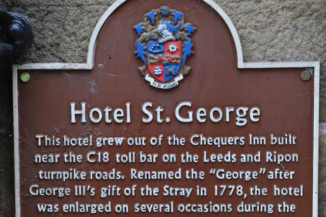 A brown plaque at the former St George Hotel in Harrogate outlining its heritage which began as the Chequers Inn in the18th century. (Picture Gerard Binks)