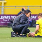 Harrogate Town midfielder Ben Fox receives treatment from physio Rachel McGeachie during Saturday's 3-1 home defeat to Notts County. Picture: Matt Kirkham