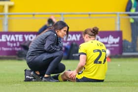 Harrogate Town midfielder Ben Fox receives treatment from physio Rachel McGeachie during Saturday's 3-1 home defeat to Notts County. Picture: Matt Kirkham