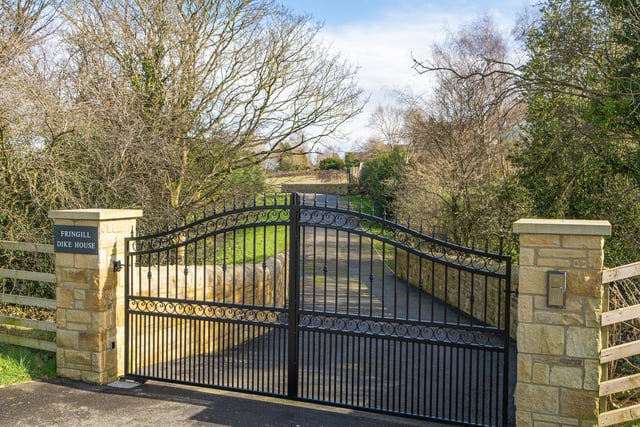 Security gates and the driveway to Fringill Dike House.