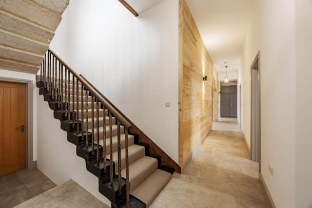 An original staircase in the Grain Store with wrought iron handrails and spindles.