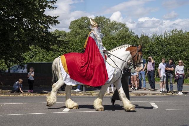 St Wilfrid, who is played by an actor, traditionally leads the procession on his horse.