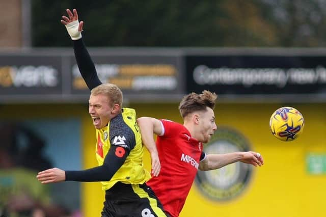 Dean Cornelius challenges for a header during Harrogate Town's 1-1 home draw with Swindon at Wetherby Road. Picture: Matt Kirkham