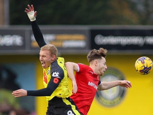 Dean Cornelius challenges for a header during Harrogate Town's 1-1 home draw with Swindon at Wetherby Road. Picture: Matt Kirkham