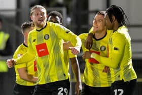 Harrogate Town forwards Luke Armstrong, left, Jack Muldoon, centre, and Sam Folarin all played key roles in Boxing Day's 3-2 League Two win over Grimsby Town. Pictures: Ben Roberts/ProSportsImages