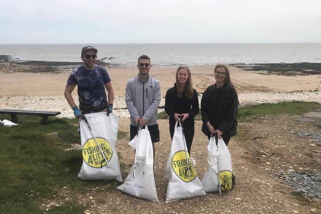 Pictured: A group collecting litter at South Landing Beach, Flamborough.