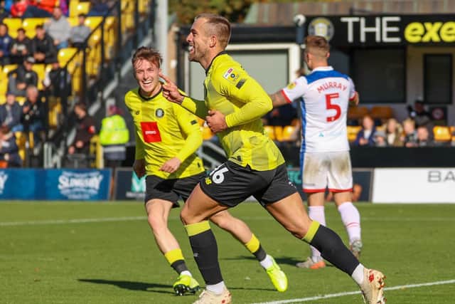 Alex Pattison celebrates after finding the net to give Harrogate Town a 25th-minute lead against Hartlepool United.