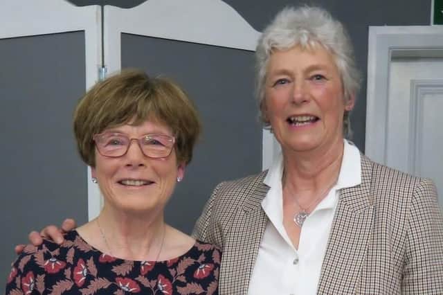 Oakdale GC's new lady captain Margaret Liddle, left, with her predecessor Lynn Wood. Picture: Submitted