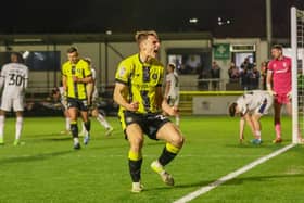 Tom Cursons celebrates after heading Harrogate Town into a 2-0 lead against Tranmere Rovers on Tuesday evening. Pictures: Matt Kirkham