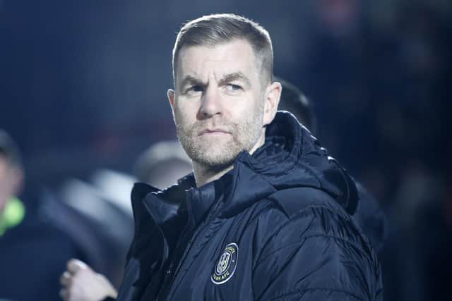 Harrogate Town manager Simon Weaver watches on at Moor Lane.