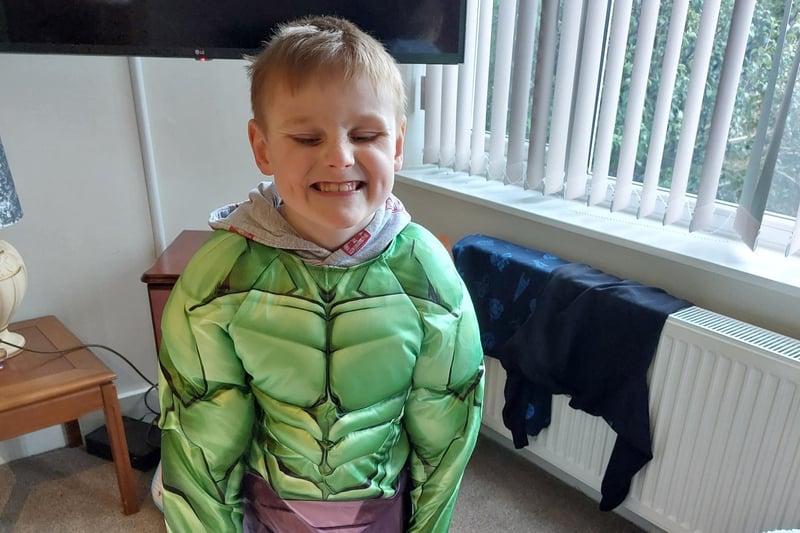 A youngster dressed up as the Incredible Hulk