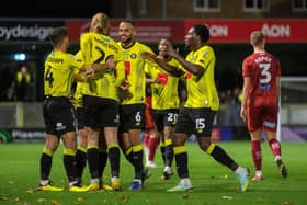 Harrogate Town's Luke Armstrong, centre, pictured celebrating a goal earlier in the season. (Picture Bruce Rollinson)