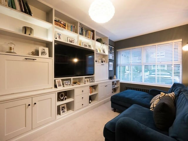 A TV snug with fitted furniture.