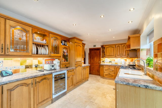 The kitchen has extensive fitted units, and plenty of dining space (not shown on photograph.)
