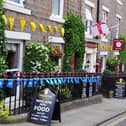 Flags displayed at the White Rose Hotel in Askrigg. (Pic credit: Tony Johnson)