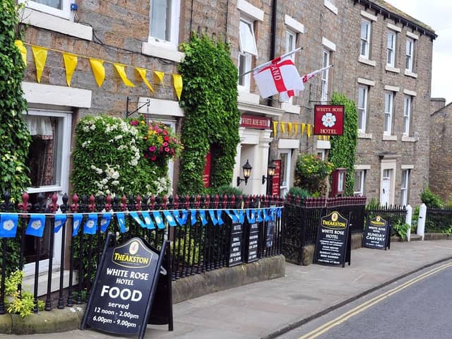 Flags displayed at the White Rose Hotel in Askrigg. (Pic credit: Tony Johnson)