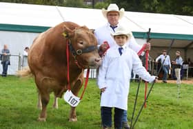 Pictured: Thor Atkinson and his son nine year old sone Frankie Atkinson with their prize winning British Blonde called Plato.