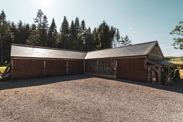 In addition to the house there is a well built timber clad garage, and workshop across the wide gravelled parking area.
