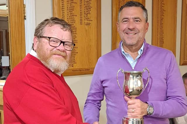 Mike Thomas, winner of Harrogate GC's club captain's prize receives his trophy from men’s club captain Stephen Wildridge at the Rabbits' annual dinner. Picture: Submitted