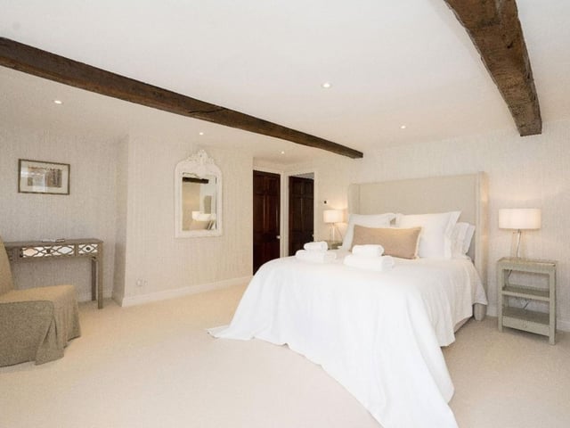 A double bedroom with exposed beams which boasts additional space.