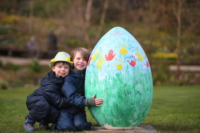 Four-year-old Teddy West and his brother, five-year-old William, with one of the giant eggs