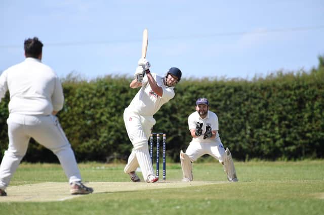 Rob Smith hits a six while batting for Pannal CC. Picture: Gerard Bings