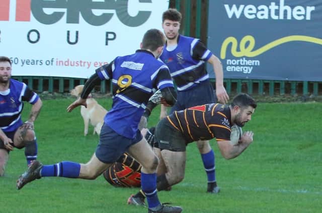 James Audsley-Beck dives over the whitewash to register one of his two tries during Harrogate Pythons' home win against Yarnbury RFC. Picture: Submitted