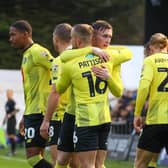 Harrogate Town's players celebrate after taking an early lead during their recent 3-0 win over Mansfield. Pictures: Matt Kirkham