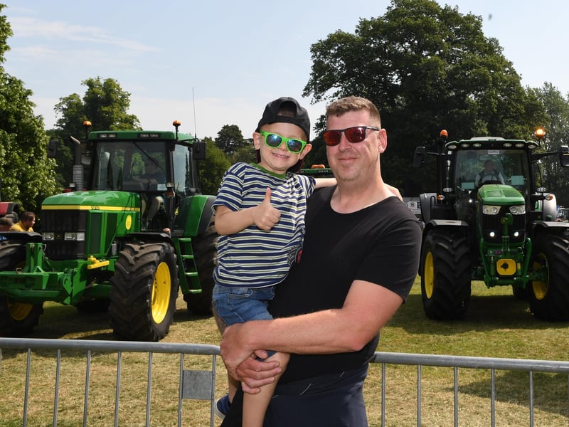 Otis Sellers-Lumb (aged four) watching the tractors on parade with his dad Ernie