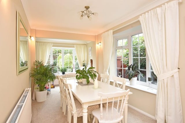 The dining room is another pleasant room, with bay windows.