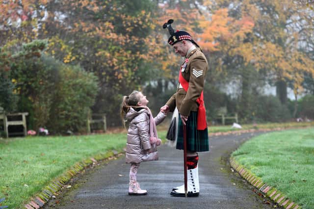 Luna Gordon (aged five) inspects her dad Sgt Ross Gordon from the Royal Regiment of Scotland before he goes on parade