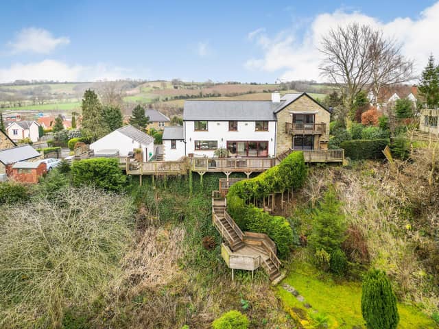 Steps lead down from the house and through gardens to the River Wharfe.