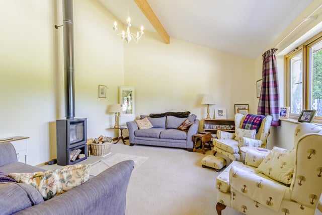 A light and lovely lounge with wood burner cosiness.