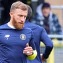 George Thomson warms up ahead of Harrogate Town's League Two clash with Doncaster Rovers. Pictures: Matt Kirkham