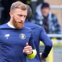 George Thomson warms up ahead of Harrogate Town's League Two clash with Doncaster Rovers. Pictures: Matt Kirkham