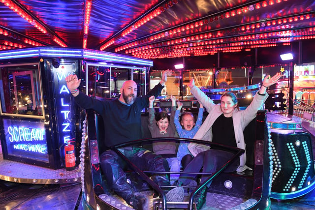 Pictured families enjoy the waltzer ride.