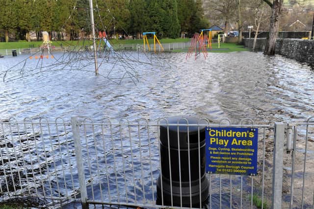 The playground at Pateley Bridge is pictured under flood waters during one of the many times the River Nidd has burst its banks in recent years.